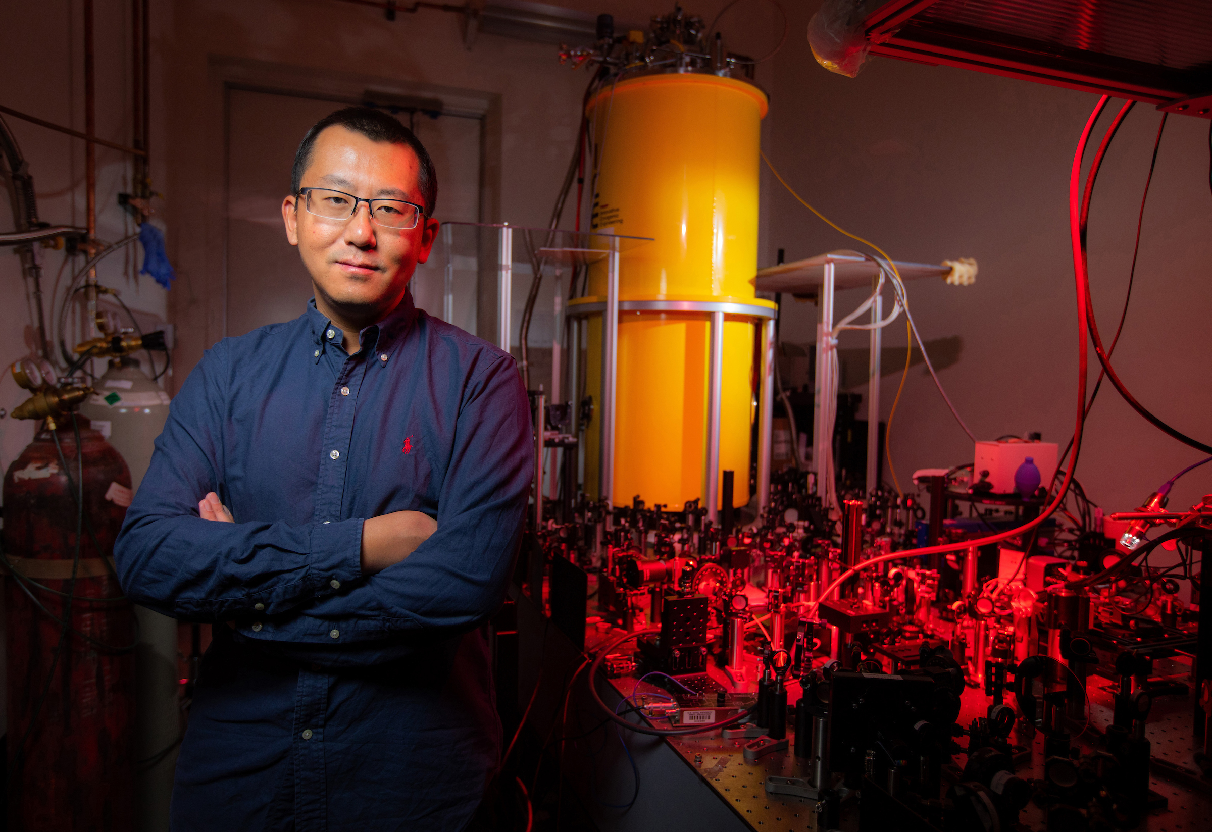 Jigang Wang with his Cryogenic Magneto-Terahertz Scanning Near-field Optical Microscope. (That’s cm-SNOM for short.) The instrument works at extreme scales of space, time and energy. Its performance is a step toward optimizing the superconducting quantum bits that will be at the heart of quantum computing. Larger photo. Photos by Christopher Gannon/Iowa State University.