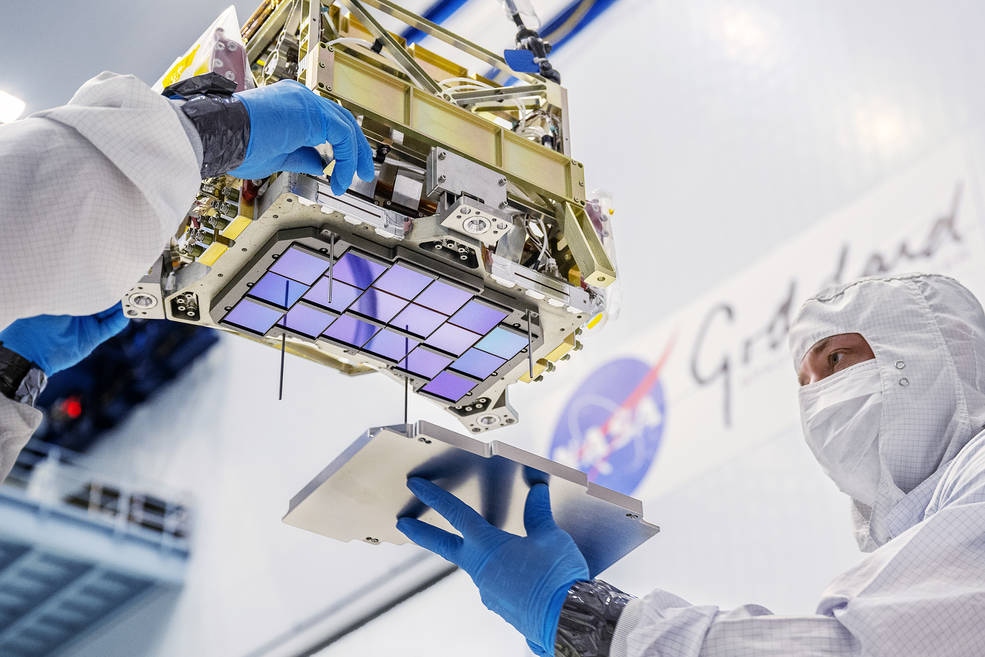 Principal technician Billy Keim installs a cover plate over the detectors for NASA’s Nancy Grace Roman Space Telescope. Credit: NASA/Chris Gunn