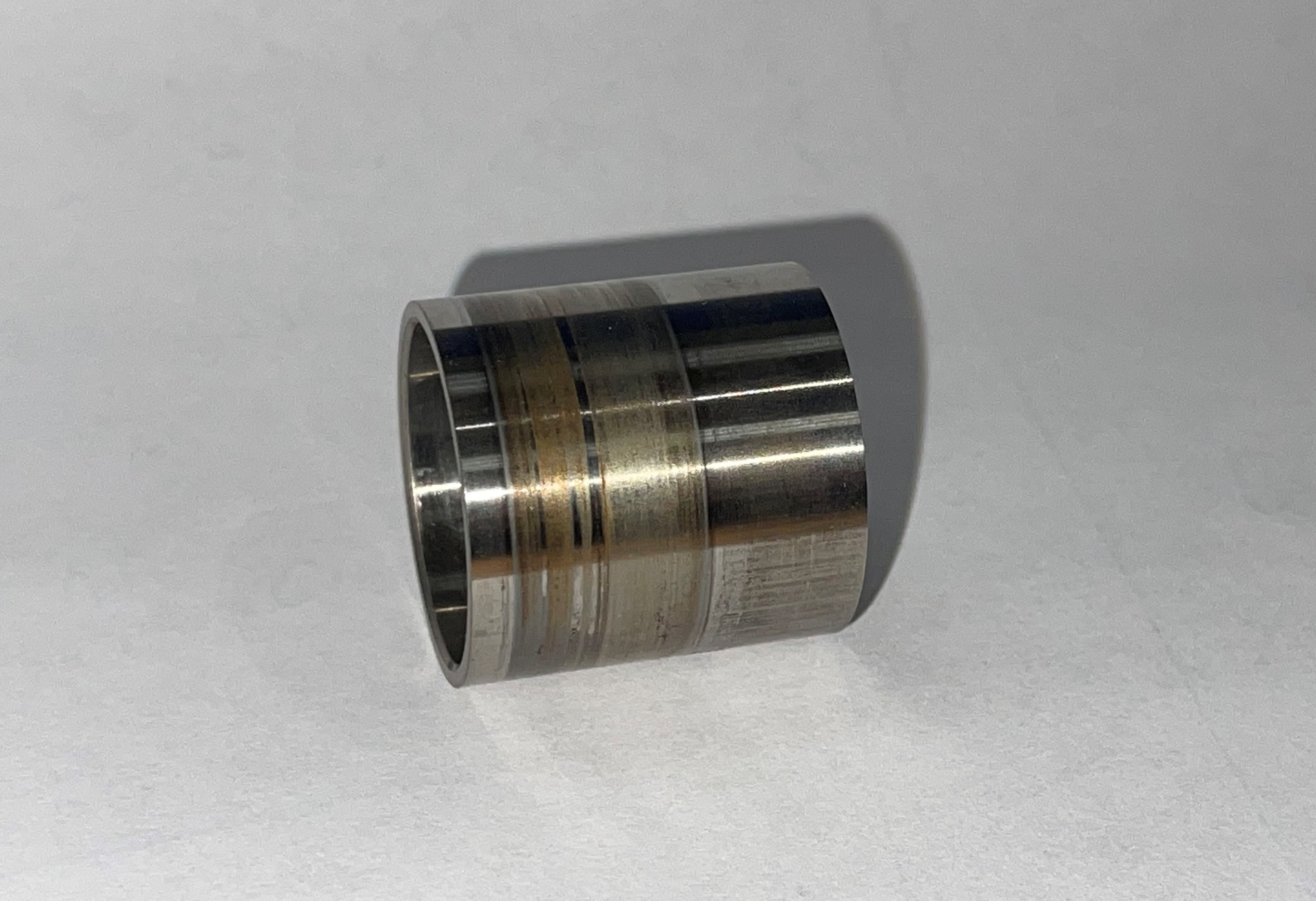 Figure 2. PTFE transfer film burnished onto a counterface bushing. Credit: RBC Transport Dynamics