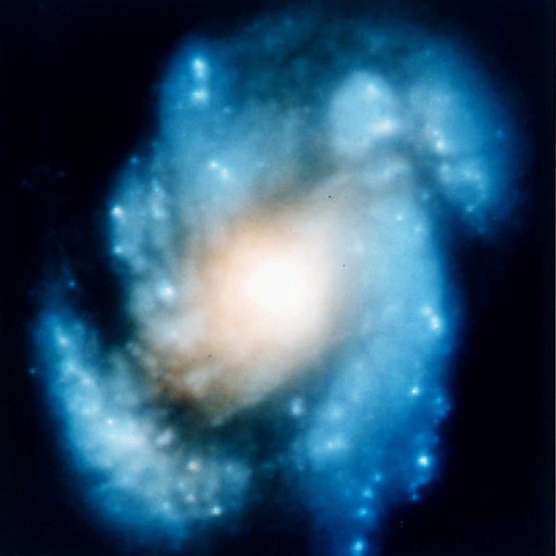Images of the galaxy M100 taken by the Hubble Space Telescope before and after astronauts installed a corrective lens on the telescope’s primary mirror in December 1993. NASA