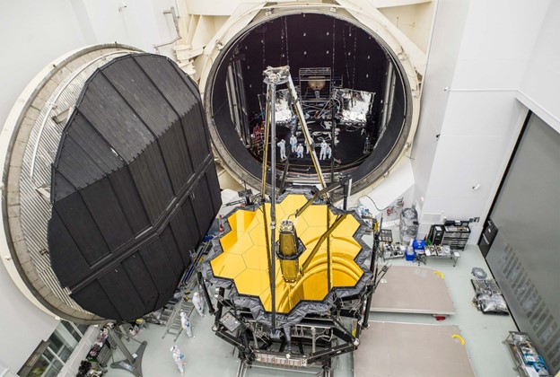 The Webb telescope emerged from a vacuum chamber at NASA’s Johnson Space Center in Houston on December 1, 2017, after about 100 days of cryogenic testing. Hurricane Harvey raged outside while the telescope experienced a cold, airless environment akin to that of space. Chris Gunn/NASA